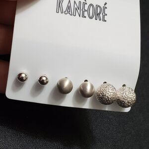 Silver tone round earring set of three